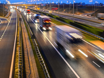 view of moving cars on a motorway at dawn