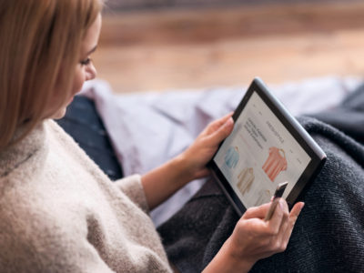 woman shopping online at her tablet